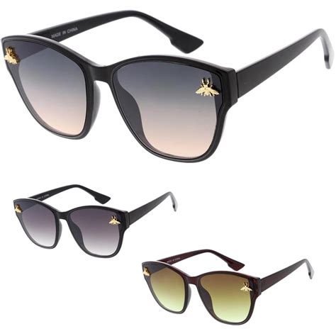 sunglasses with bee in the middle|sunglasses with a bee emblem.